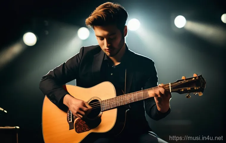 기타 핑거스타일 기법 - A male fingerstyle guitarist, in his late 20s, performing intensely on a dimly lit stage with a spot...